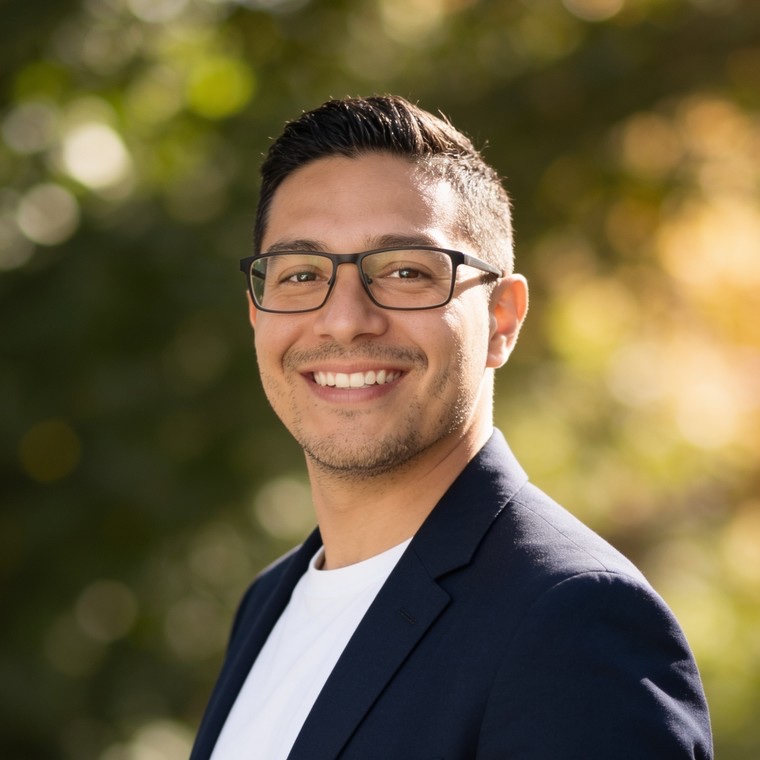 Man in his mid thirties in a professional headshot made by still.