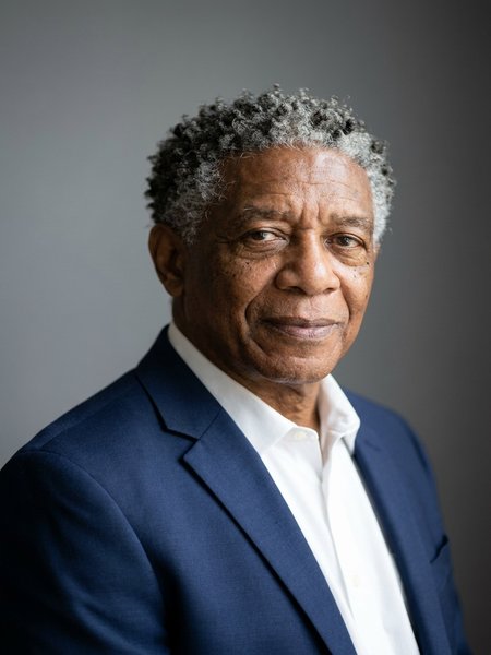AI-generated professional headshot by still., made from the selfie above