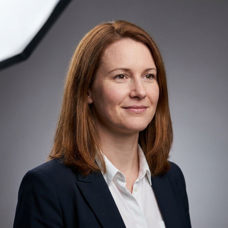 Studio portrait on a mid-grey seamless backdrop