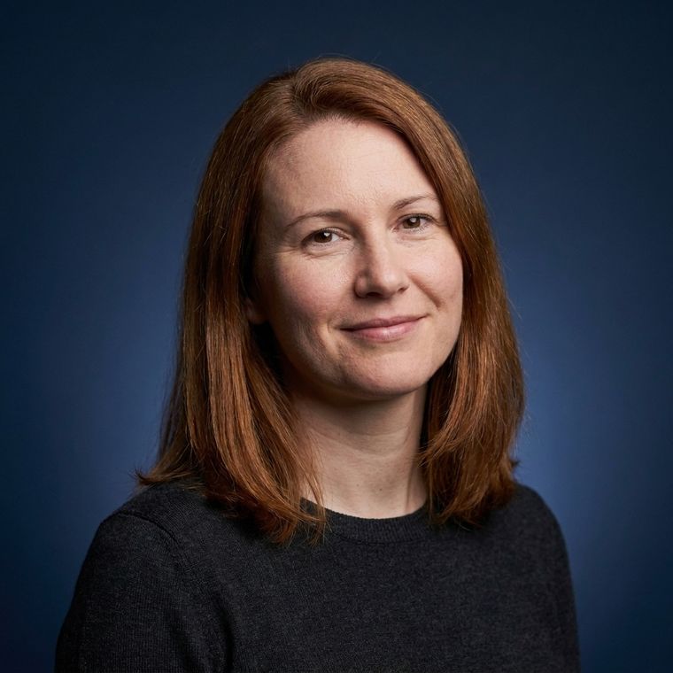 Portrait on a navy backdrop with clamshell lighting
