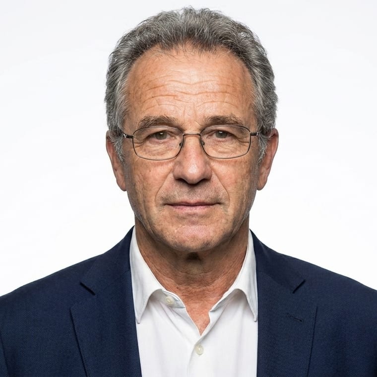The same man on a white background, lit with soft clamshell lighting, facing the camera square on.